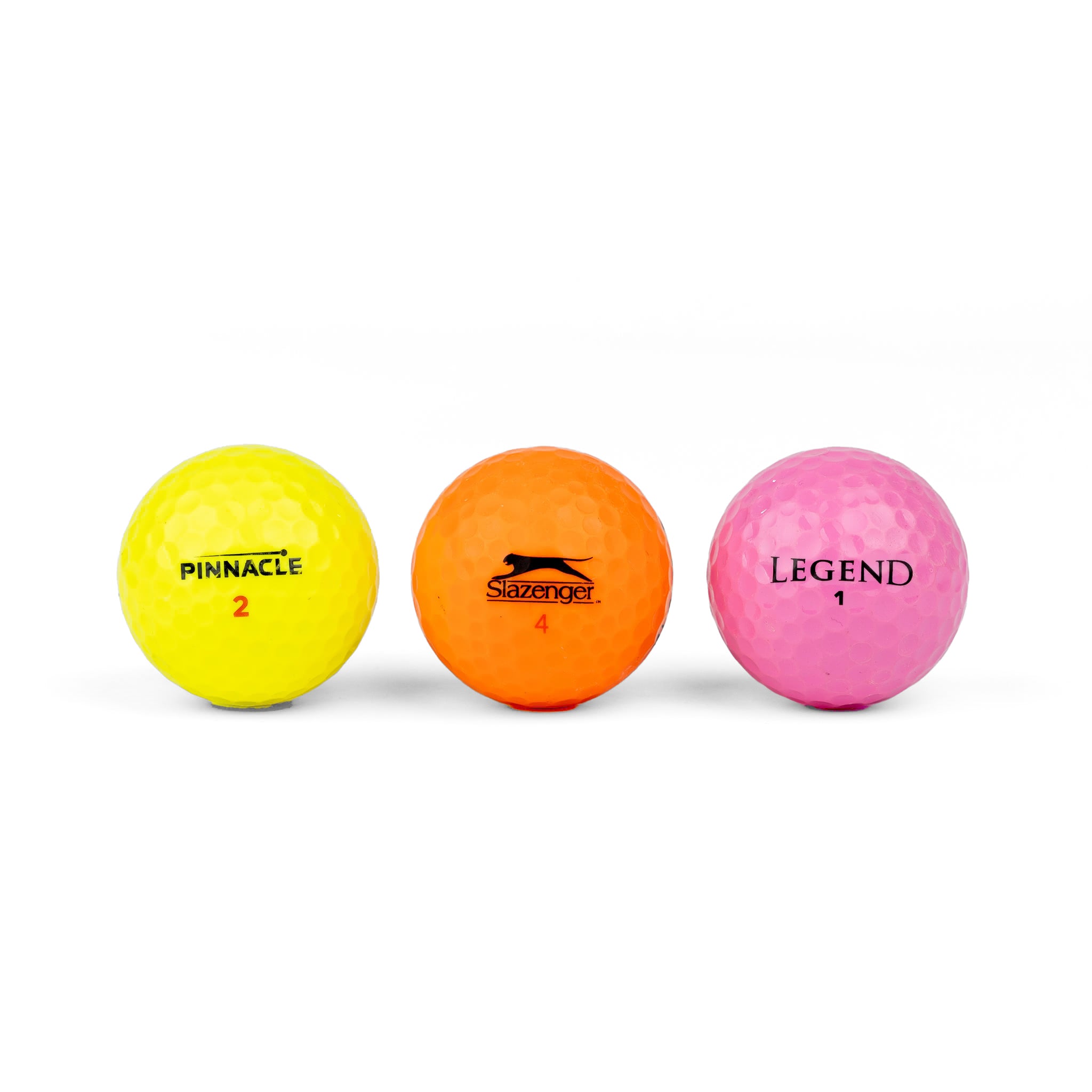 Colored golf balls (pink, orange, yellow)