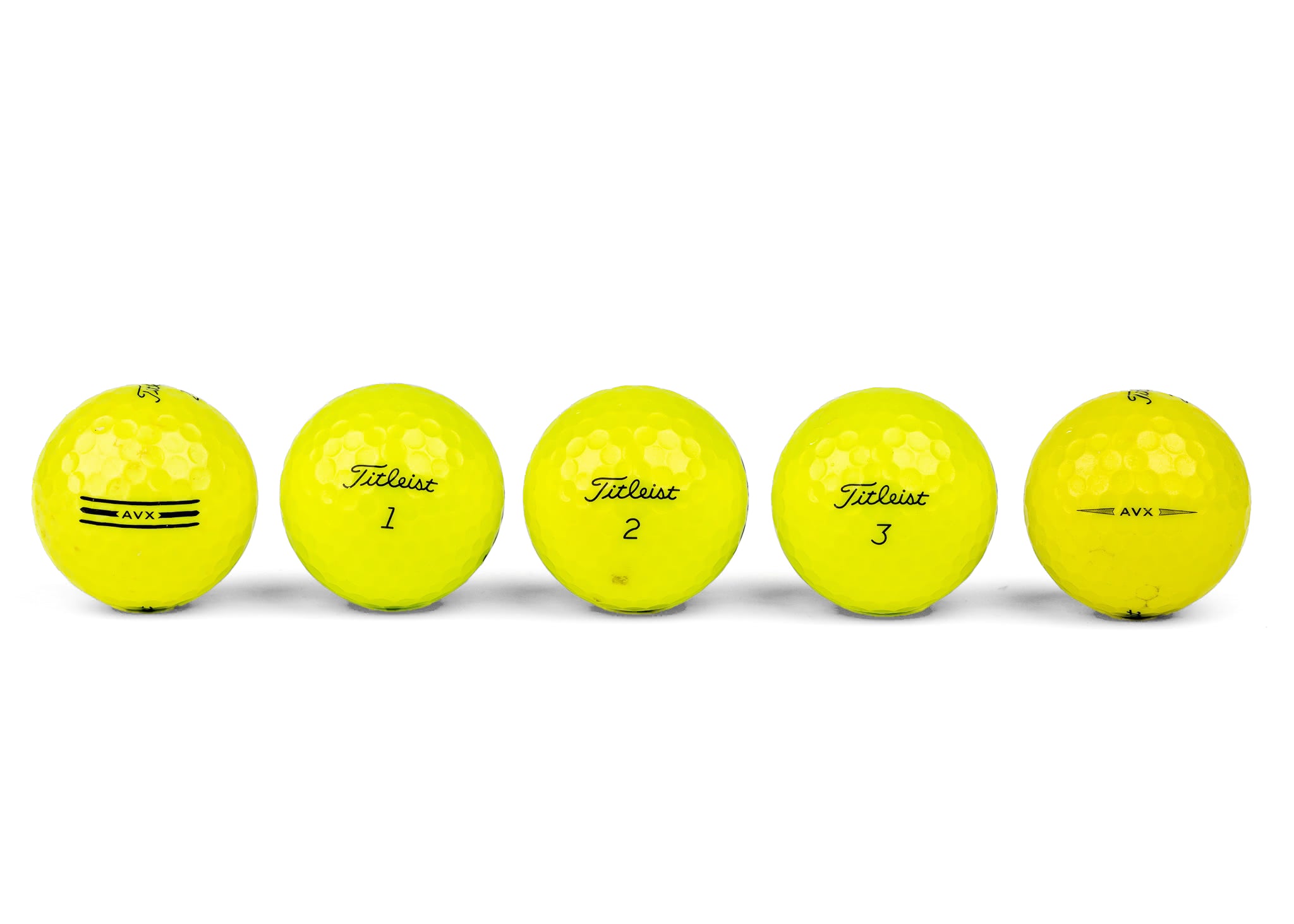 Colored golf balls (pink, orange, yellow)