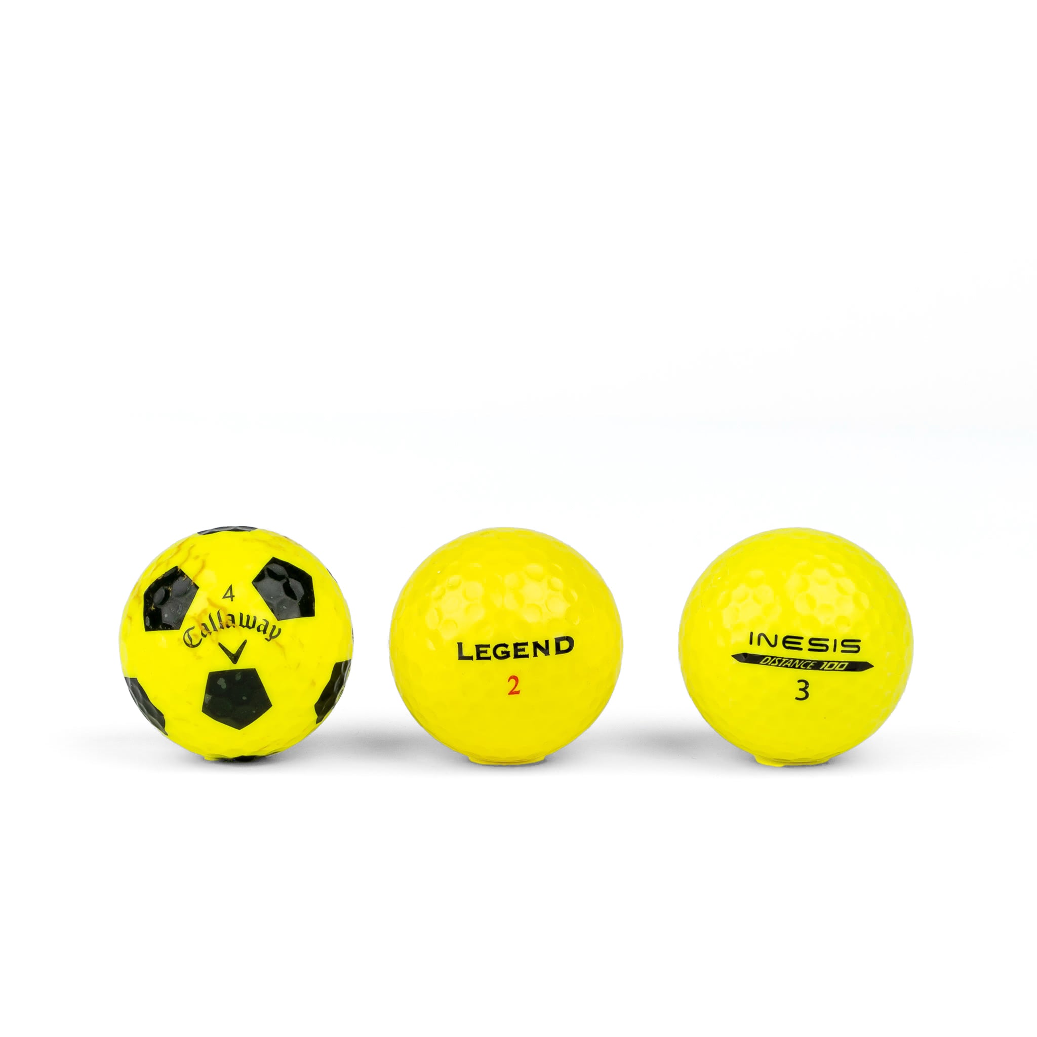 Colored golf balls (pink, orange, yellow)