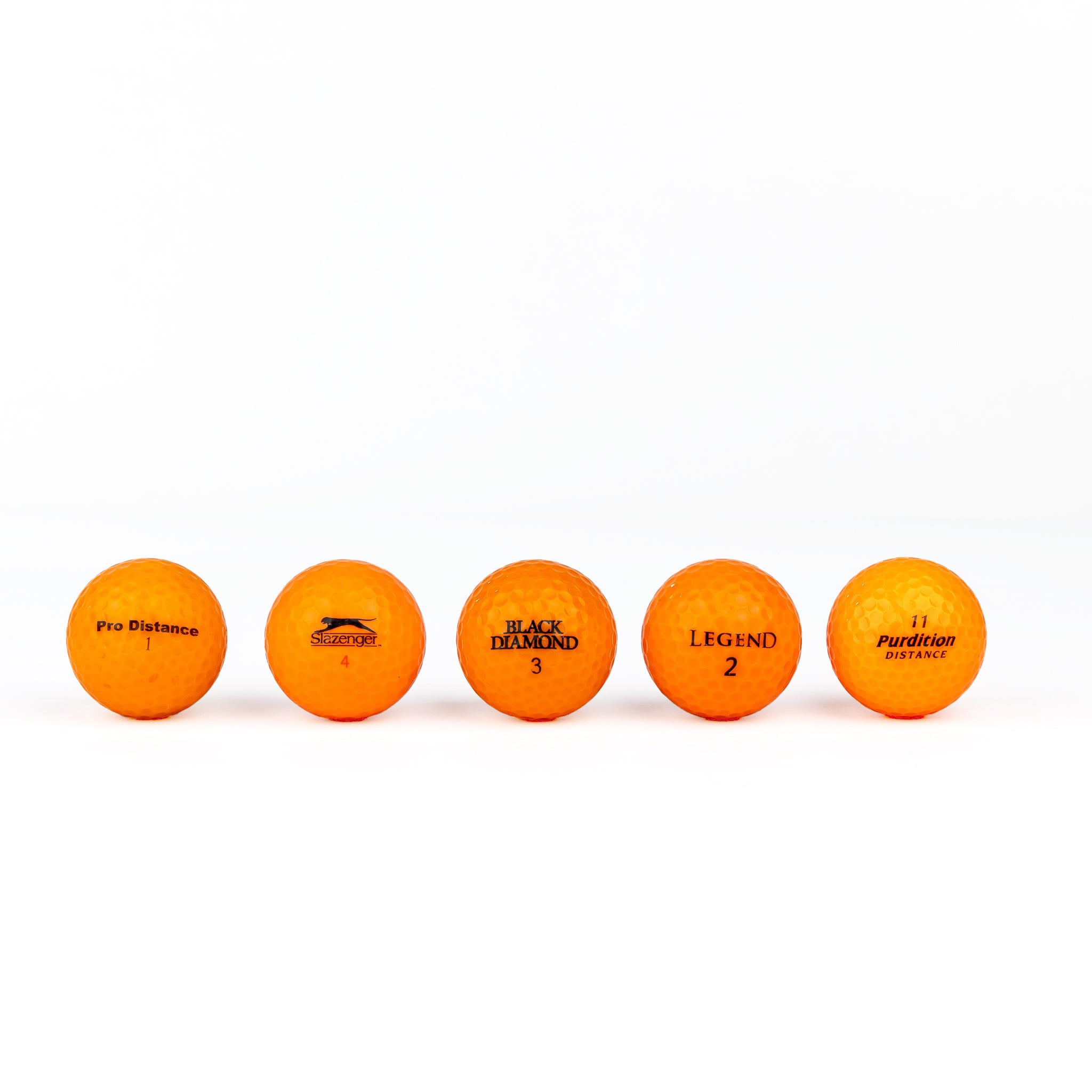 Colored golf balls (pink, orange, yellow)