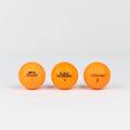 Colored golf balls (pink, orange, yellow)