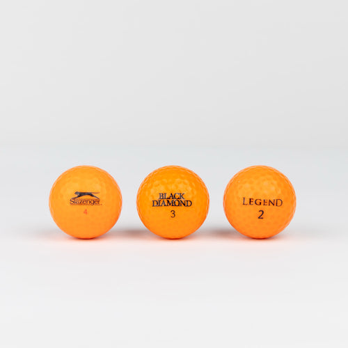 Colored golf balls (pink, orange, yellow)