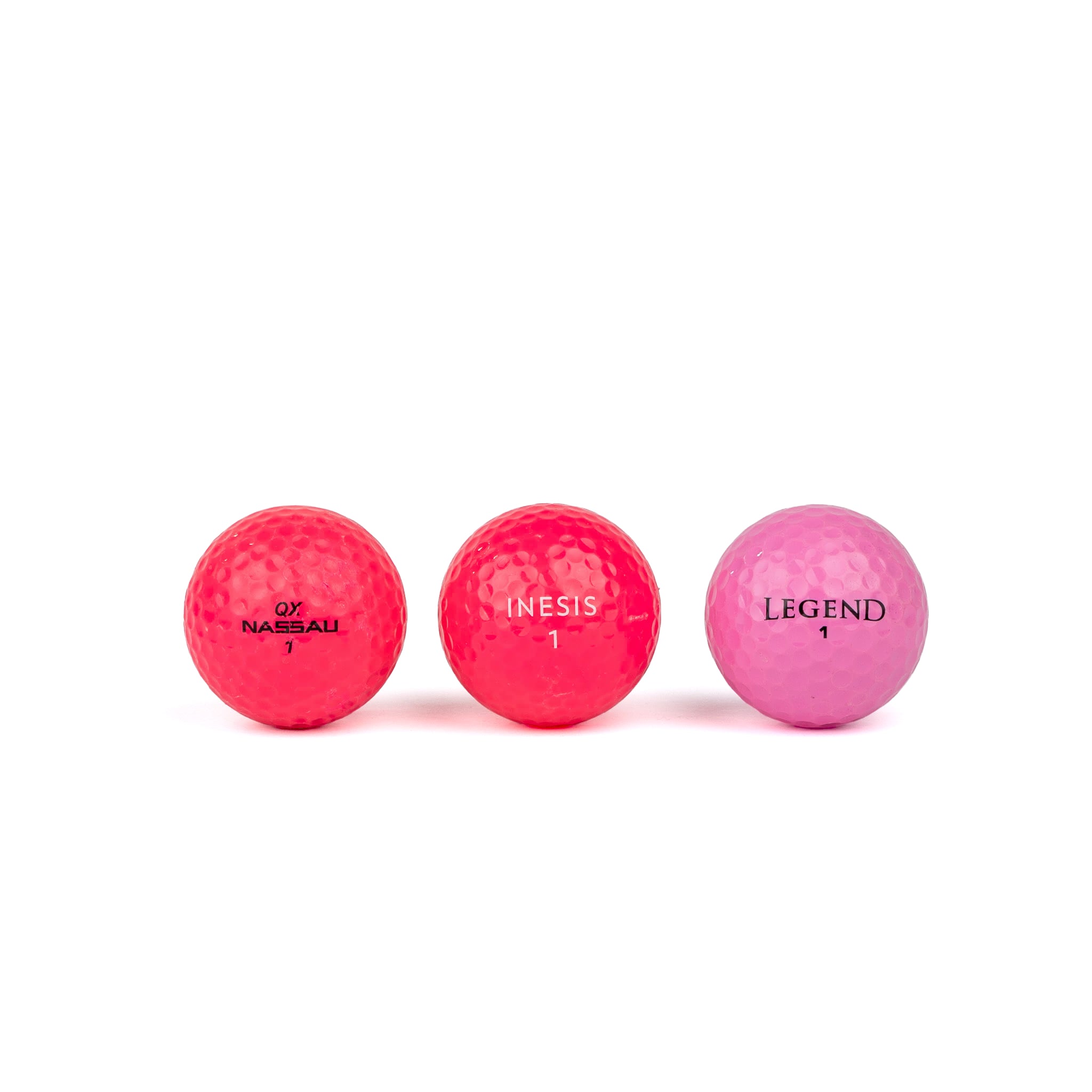 Colored golf balls (pink, orange, yellow)