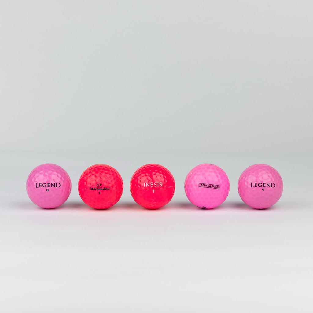 Colored golf balls (pink, orange, yellow)